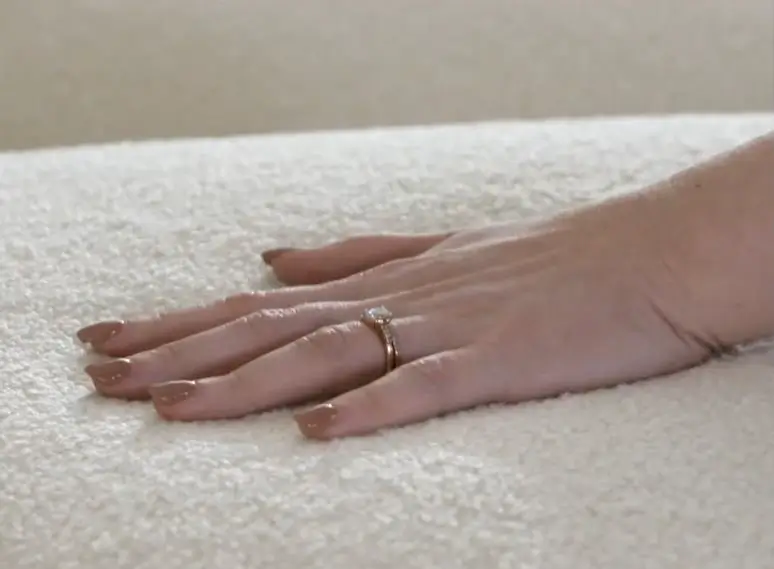 Hand resting on a Flexsteel sofa