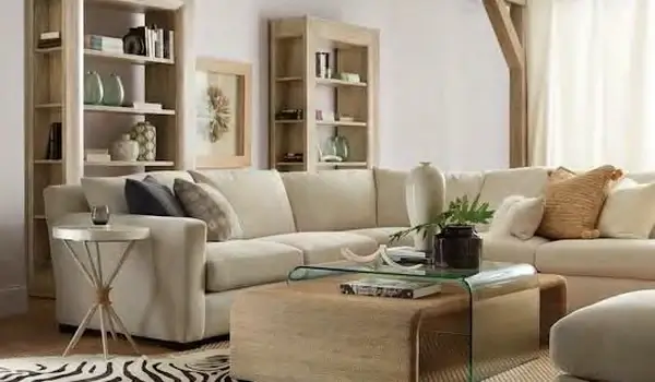 American Life Amani collection living room with a cream sectional and organic accents