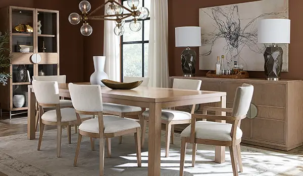 Sonnet collection dining room with a white oak table, cane chairs and a sideboard