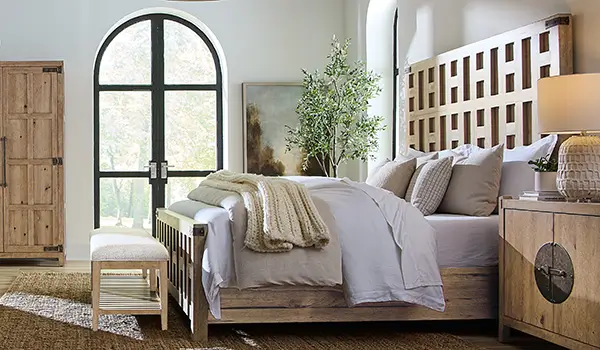 Vineyard Row collection bedroom with a rustic hickory armoire and arched window