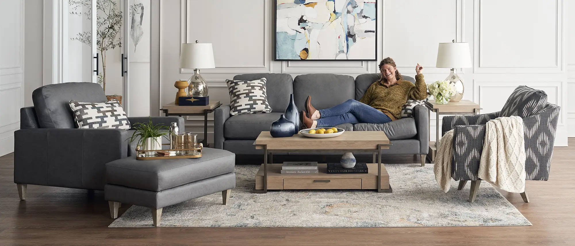 A man relaxing on a La-Z-Boy sofa in a styled living room