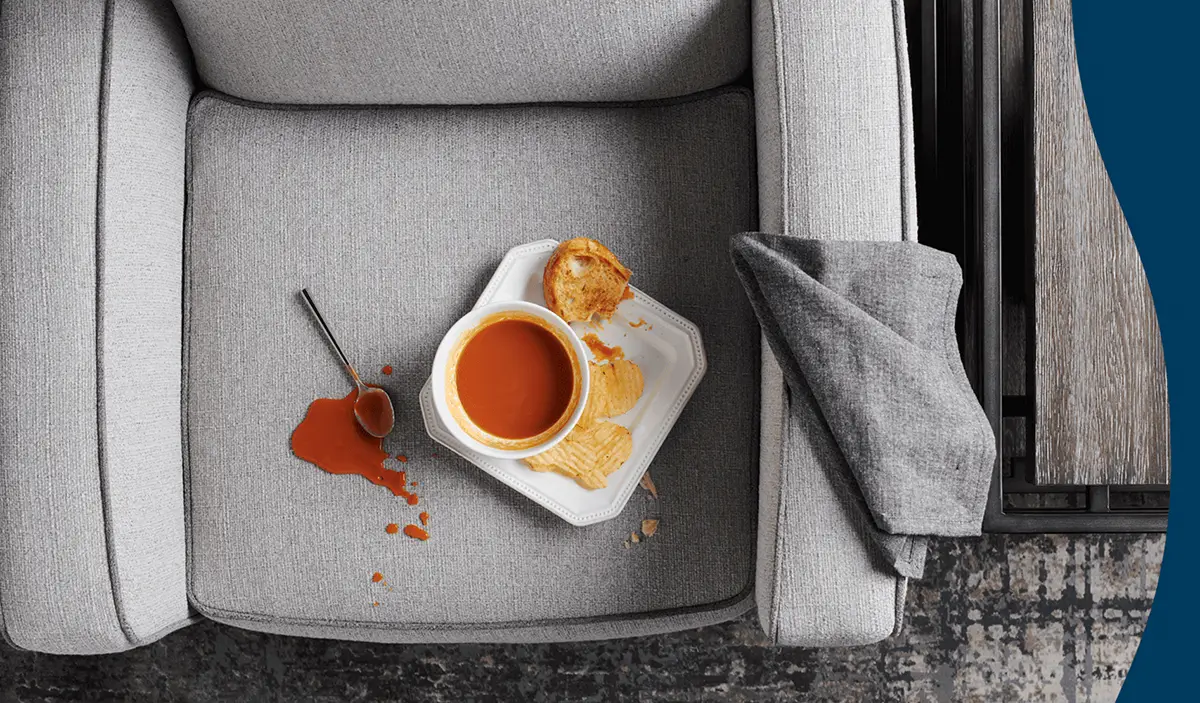Spilled soup beading on an iClean fabric chair seat